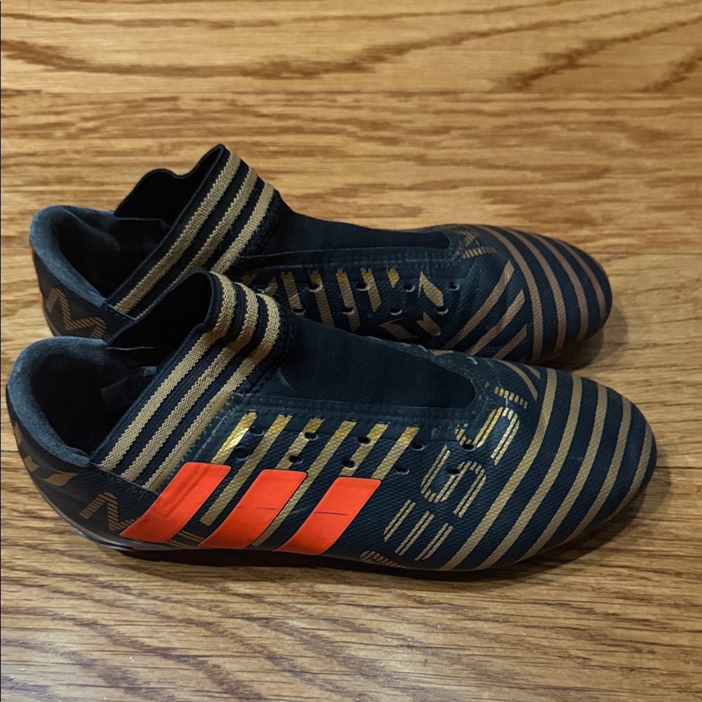 Adidas Kids Black and Gold Sneakers with Orange Accents